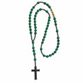 Handmade men’s Catholic rosary with green stone-style beads, dark metal spacers, gold letter details, and silver crucifix.