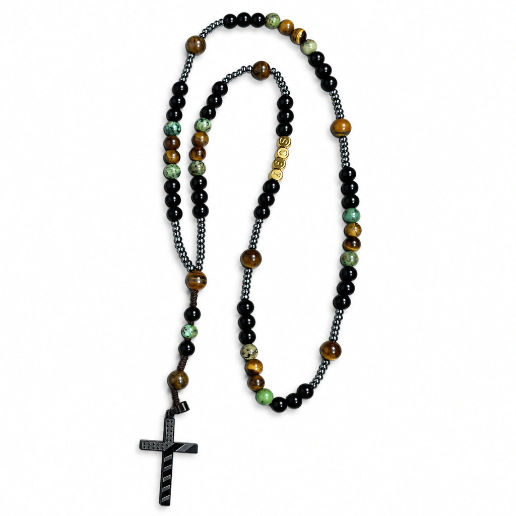 Handmade men’s Catholic rosary with black beads, tiger-eye accents, green stone-style beads, dark metal details, and black crucifix.