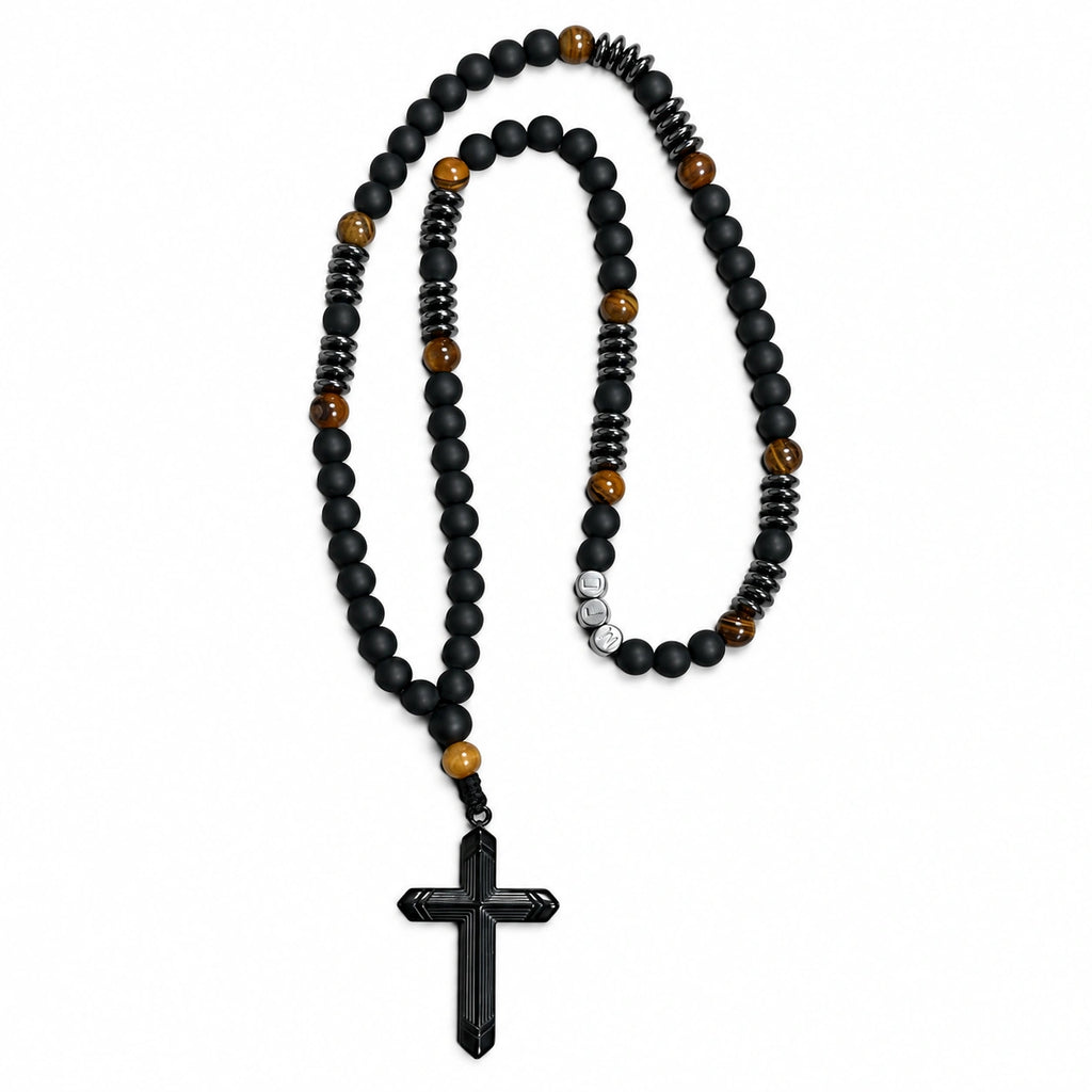 Handmade men’s black Catholic rosary with matte black beads, tiger-eye accents, dark metal details, and black crucifix.