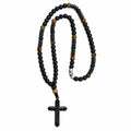Handmade men’s black Catholic rosary with matte black beads, tiger-eye accents, dark metal details, and black crucifix.