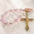 Handmade crystal Catholic prayer beads with sparkling beads, cross pendant, and religious charm for daily prayer and reflection.