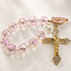 Handmade crystal Catholic prayer beads with sparkling beads, cross pendant, and religious charm for daily prayer and reflection.