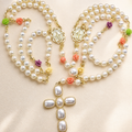Handmade pearl Catholic wedding rosary with floral accents, gold Marian medals, and large pearl cross pendant for bridal lasso ceremony.