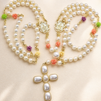 Handmade pearl Catholic wedding rosary with floral accents, gold Marian medals, and large pearl cross pendant for bridal lasso ceremony.