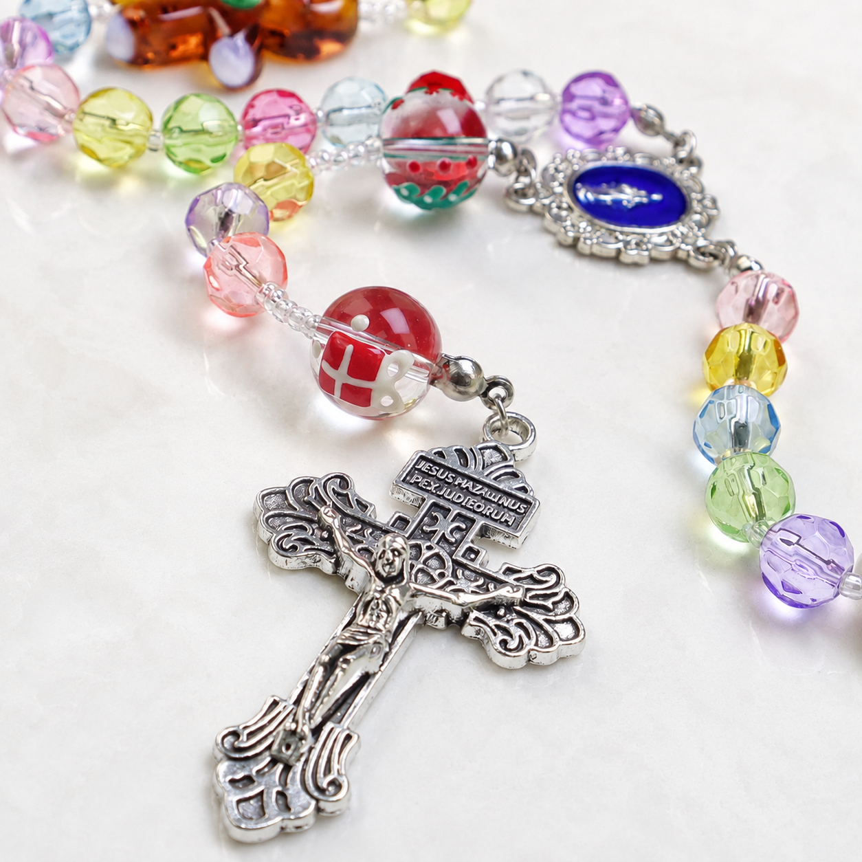 Handmade children's Catholic rosary featuring colorful beads and playful faith charms, a joyful prayer keepsake for kids and young believers.
