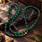 Men’s Catholic prayer beads with green natural stone-style patterns, dark metal spacer beads, and handmade rosary details.