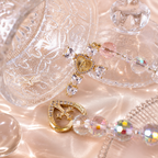 Clear crystal Catholic charm with gold heart pendant, sparkling cross detail, and religious medal for daily faith inspiration.