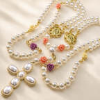Pearl wedding rosary with white pearl-style beads, colorful flower details, and gold religious charms for Catholic wedding prayer.