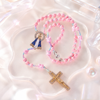 Handmade pink bunny Catholic rosary with soft pink beads, personalized letter beads, Marian medal, and gold cross for girls.