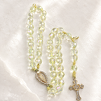 Handmade Catholic rosary bracelet with iridescent crystal beads, Marian medal, and gold cross charm for daily prayer and devotion.