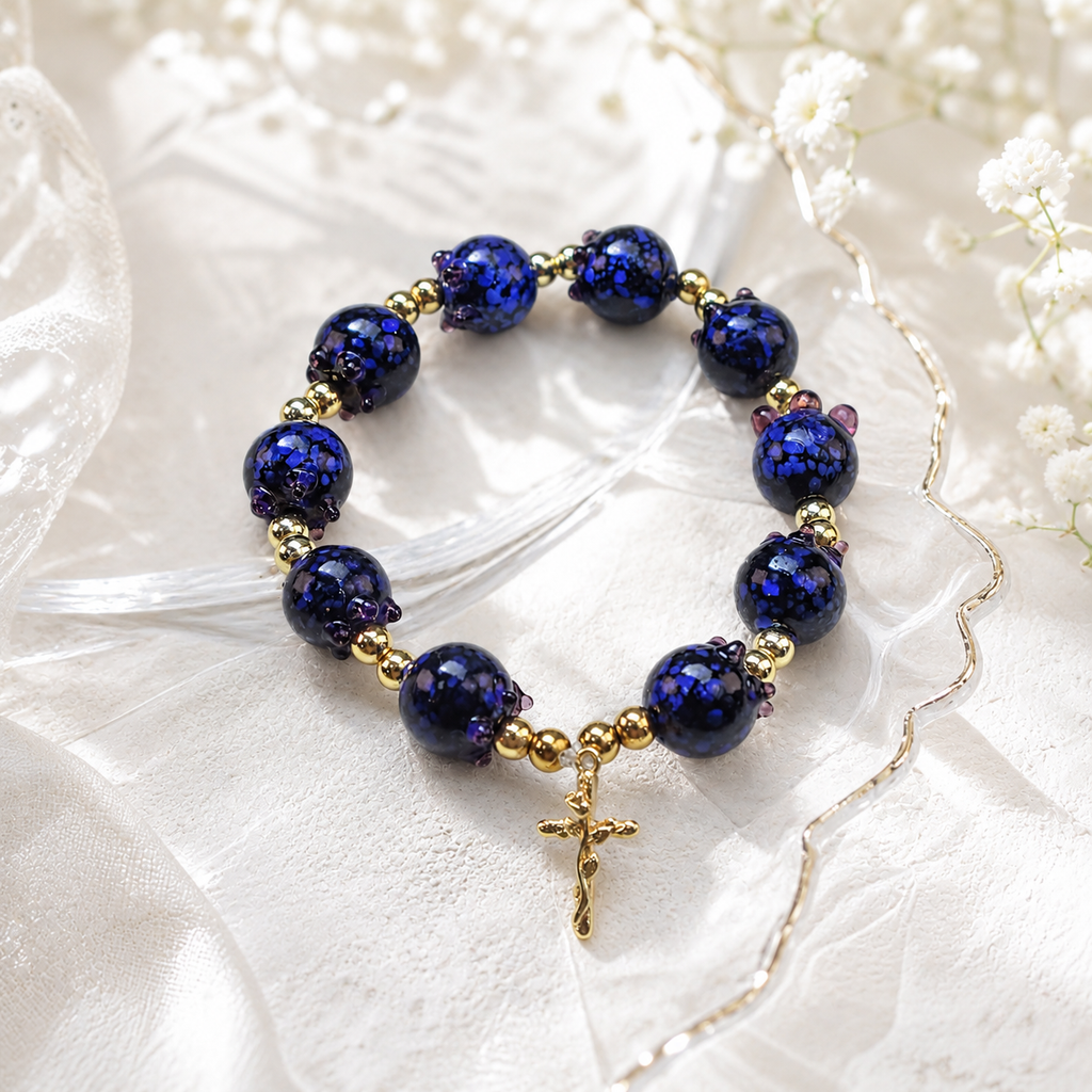 Blue bead Catholic prayer bracelet with decorative cross charm, handmade faith jewelry designed for prayer, reflection, and spiritual connection.