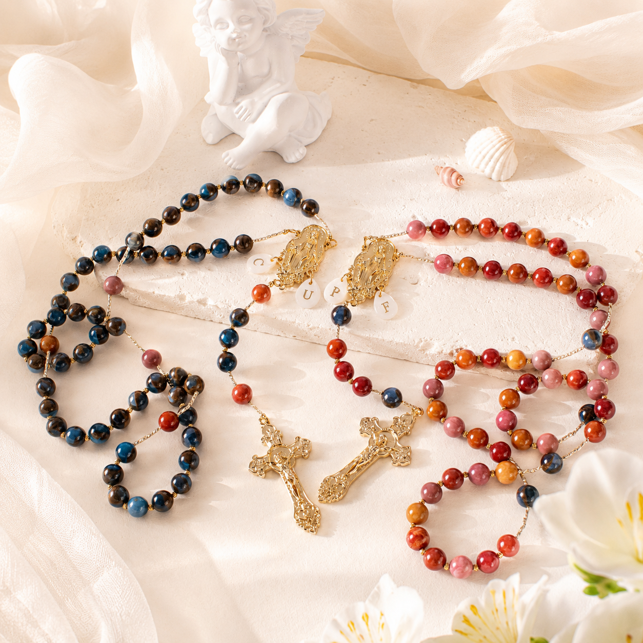 Handmade Catholic couple wedding rosary set with gemstone-style beads, Marian centerpieces, personalized letter charms, and gold crucifix pendants.