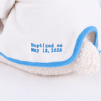 Soft plush lamb in a baptism outfit, a keepsake gift idea for a baby's christening day.