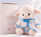 Baptism lamb plush with blue-trimmed white outfit and matching bow, personalized for a baby boy's christening.
