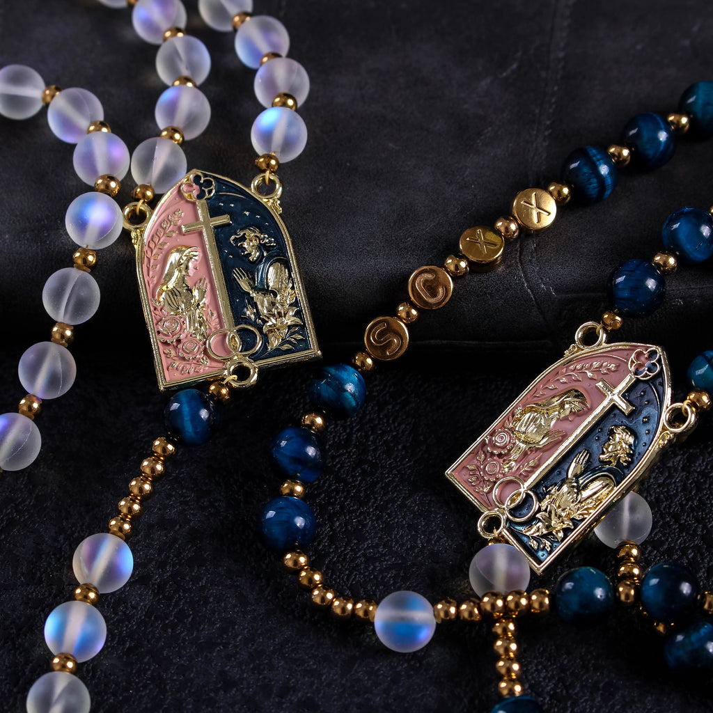 Handmade bride and groom rosary set with deep blue beads, translucent beads, gold religious details, and elegant Catholic wedding design.