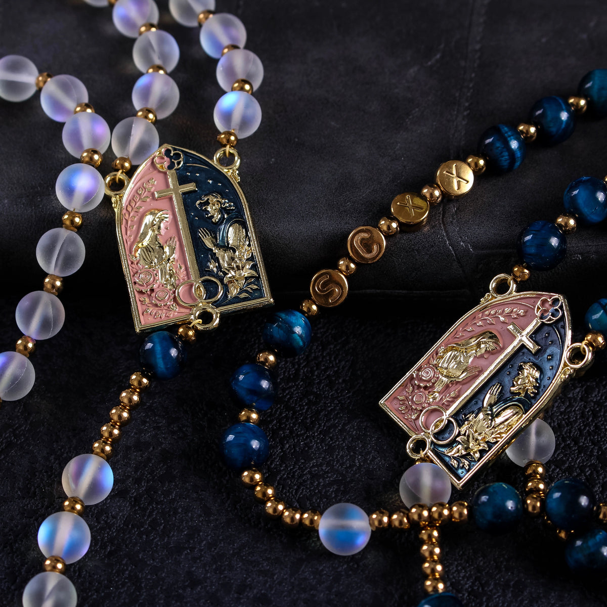 Handmade bride and groom rosary set with deep blue beads, translucent beads, gold religious details, and elegant Catholic wedding design.