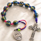 Handmade ceramic Catholic prayer beads with blue green beads, colorful hand-knotted cord, Sacred Heart medal, and silver crucifix.