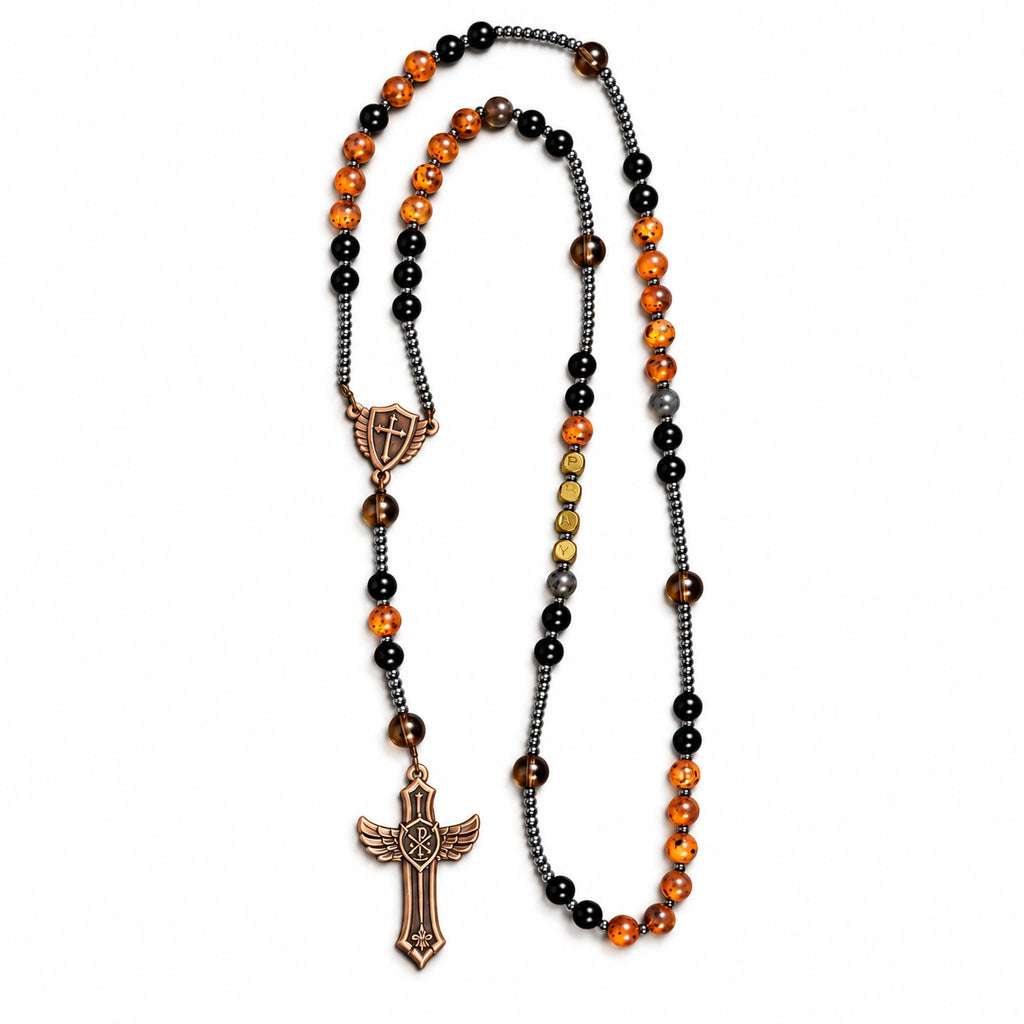 Handmade men’s Catholic rosary with black beads, UV color-changing amber accents, dark spacers, and bronze crucifix.