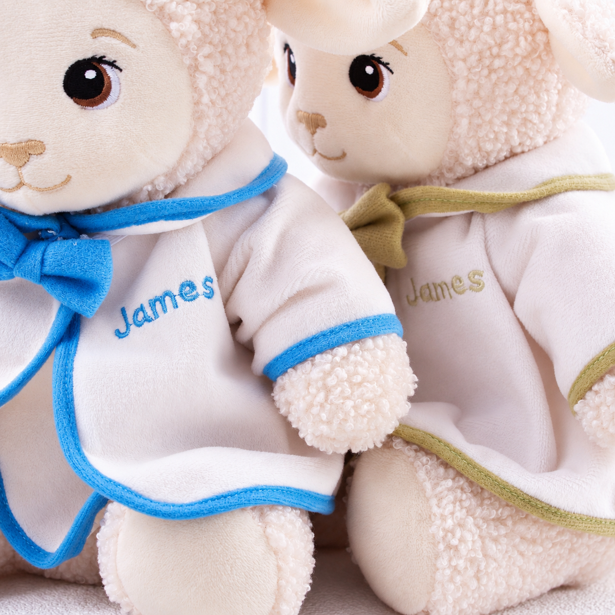 Personalized baptism lamb plush wearing a white ceremonial outfit with custom embroidery for a child's christening.