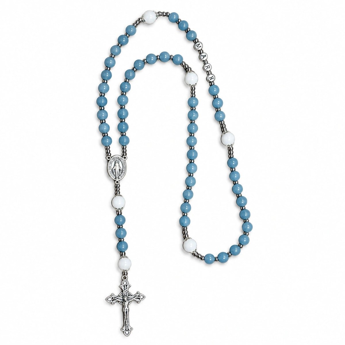 Handmade blue Catholic rosary with soft blue beads, white accents, Marian centerpiece, and silver crucifix.