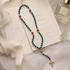 Catholic wedding rosary draped over a church pew with white ribbon and baby’s breath, perfect for bridal bouquet decor, marriage blessing, and religious wedding photography.