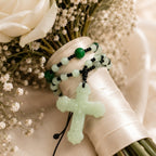 Close-up of a sage green bridal rosary featuring elegant jade-inspired beads, black accents, and a cross pendant, designed as a Catholic wedding keepsake gift.