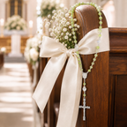 Elegant green bridal rosary displayed on a church pew with white ribbon, designed as a Catholic wedding keepsake gift