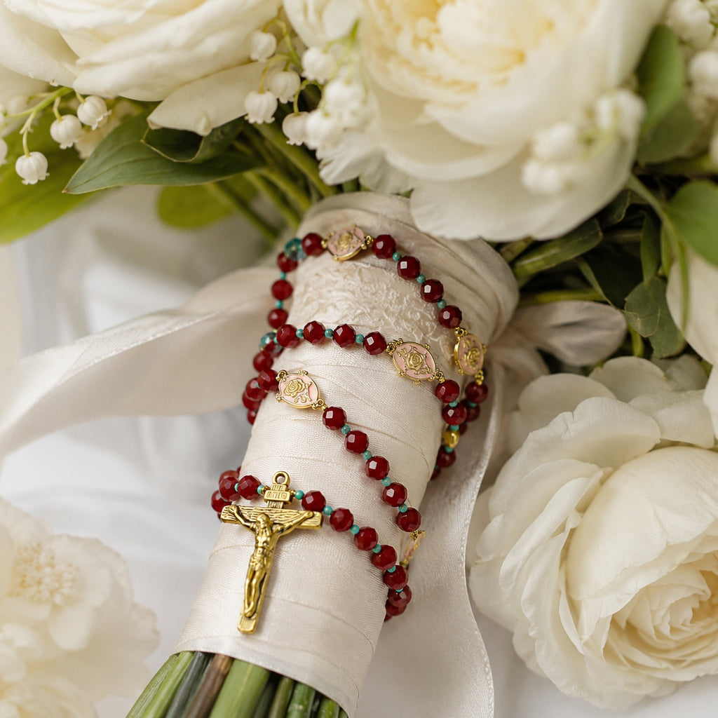 Elegant burgundy rosary displayed on soft wedding lace with turquoise beads and gold details, designed as a Catholic bride gift