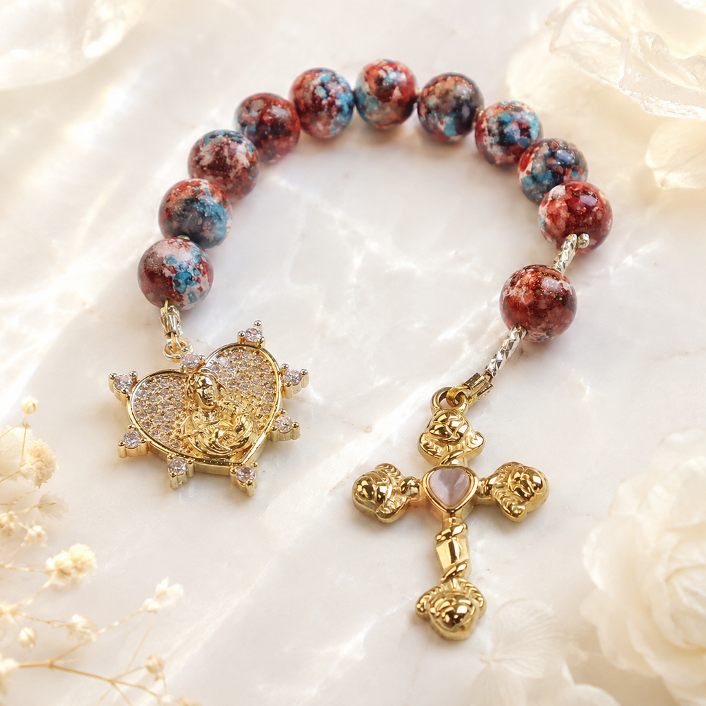Handmade Catholic prayer beads with colorful gemstone beads, religious centerpiece, and cross pendant designed as a portable prayer companion.