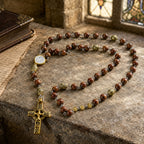 Brown Catholic rosary for men featuring natural stone beads, gold-tone accent beads, a classic crucifix, and a vintage devotional design.