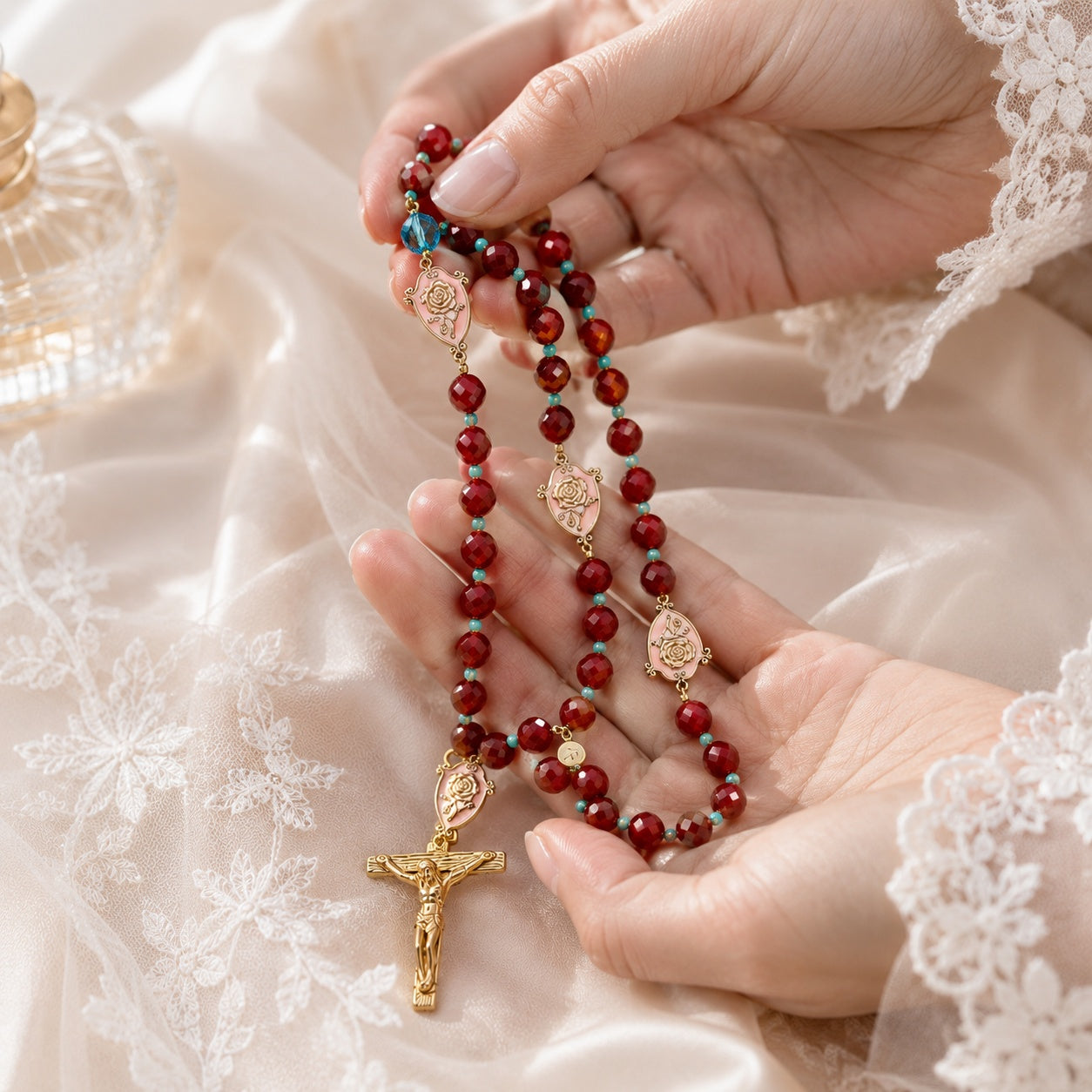 Bridal bouquet rosary with deep burgundy beads, gold-tone crucifix, and rose devotional medals for a Catholic wedding keepsake