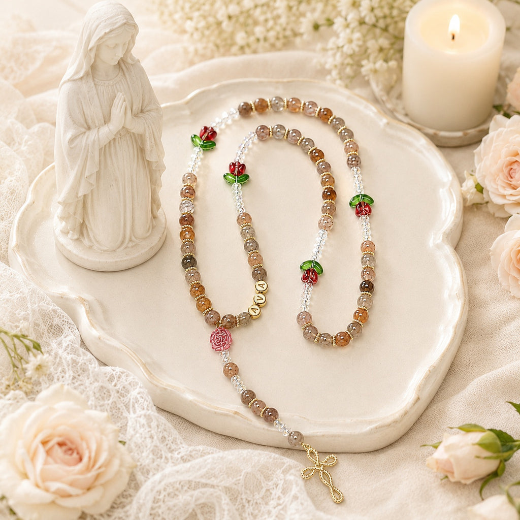 Handmade women’s Catholic rosary displayed with flowers, prayer setting, and feminine natural stone style beads for daily devotion