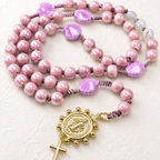 Handmade seashell Catholic rosary with shell-shaped beads, soft coastal colors, religious centerpiece, and cross pendant for daily prayer.