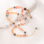 Handmade personalized Catholic rosary bracelet with colorful beads, custom letter beads, gold cross charm, and religious medal.