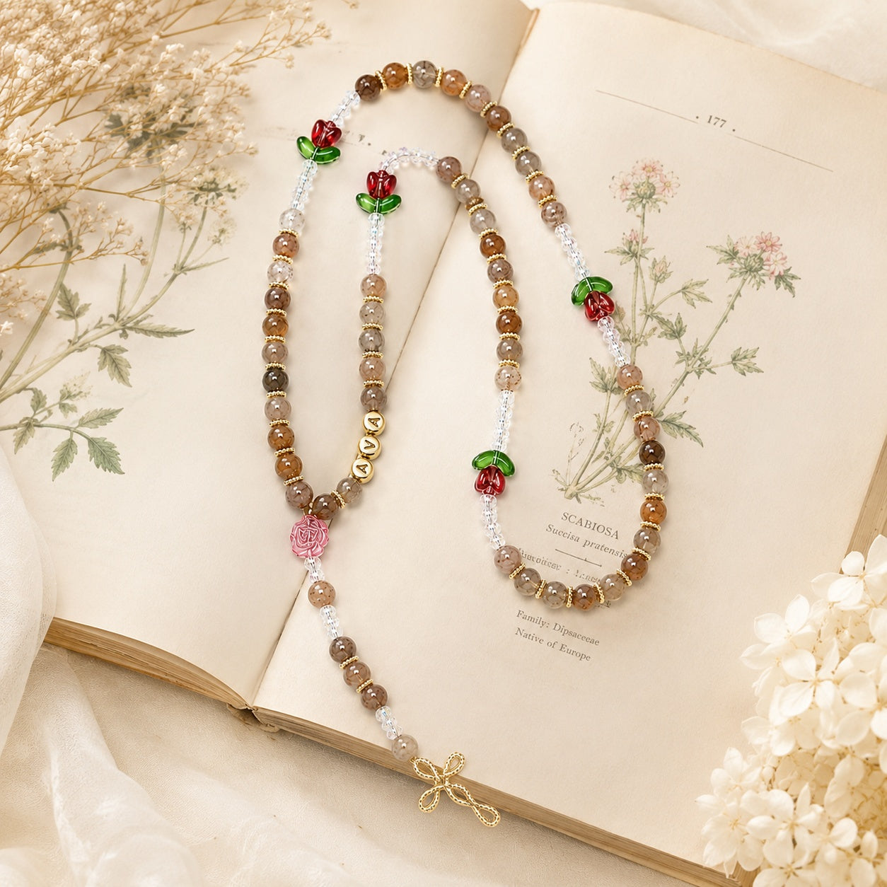 Floral Catholic prayer beads for women with personalized name detail, soft gemstone-style beads, and delicate Christian faith design