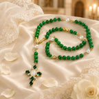 Elegant emerald green bridal rosary displayed on soft wedding lace, designed as a Catholic wedding gift and marriage blessing keepsake