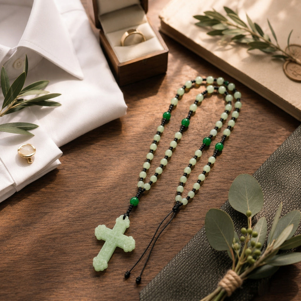 Groom holding a sage green Catholic rosary with cross pendant, symbolizing faith, prayer, and marriage blessing on the wedding day