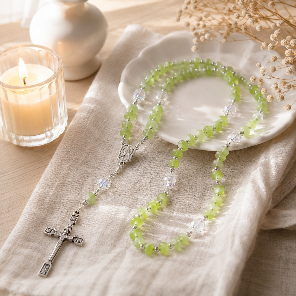 Handmade green rosary beads with silver-tone crucifix and clear crystal accents, styled as a baptism or confirmation gift