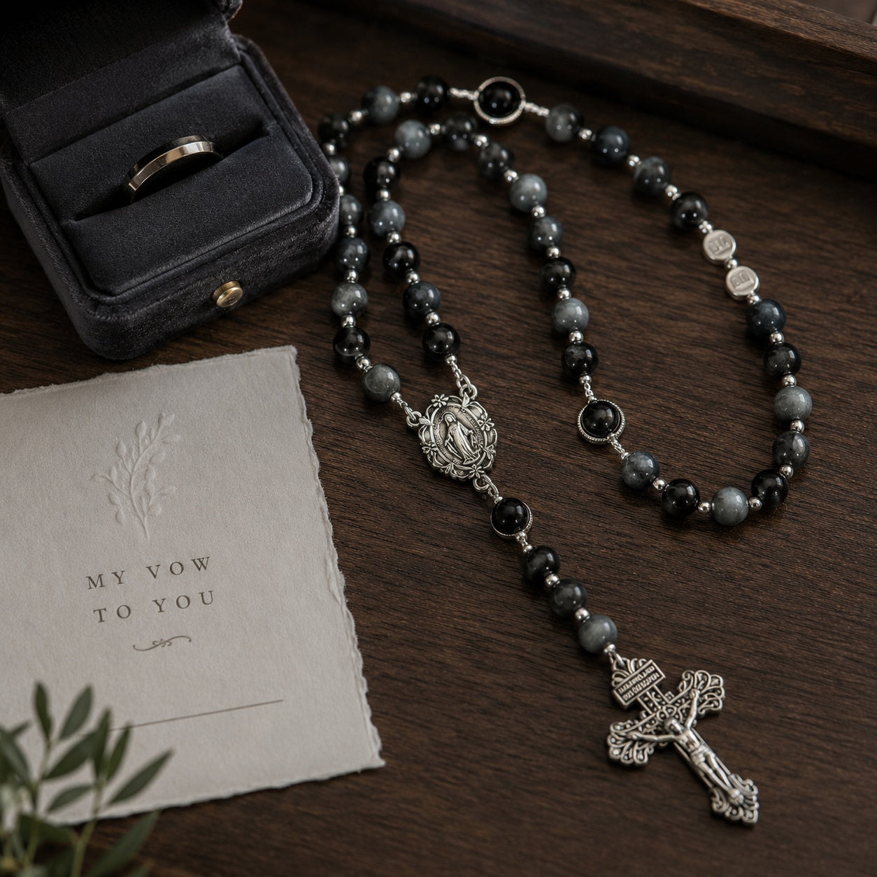Elegant men’s Catholic rosary with dark prayer beads, silver-tone crucifix, and Marian medal styled for a groom wedding gift