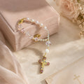 Pink Catholic car charm rosary with luminous crystal beads, initial letter bead, and gold crucifix for a meaningful driver gift
