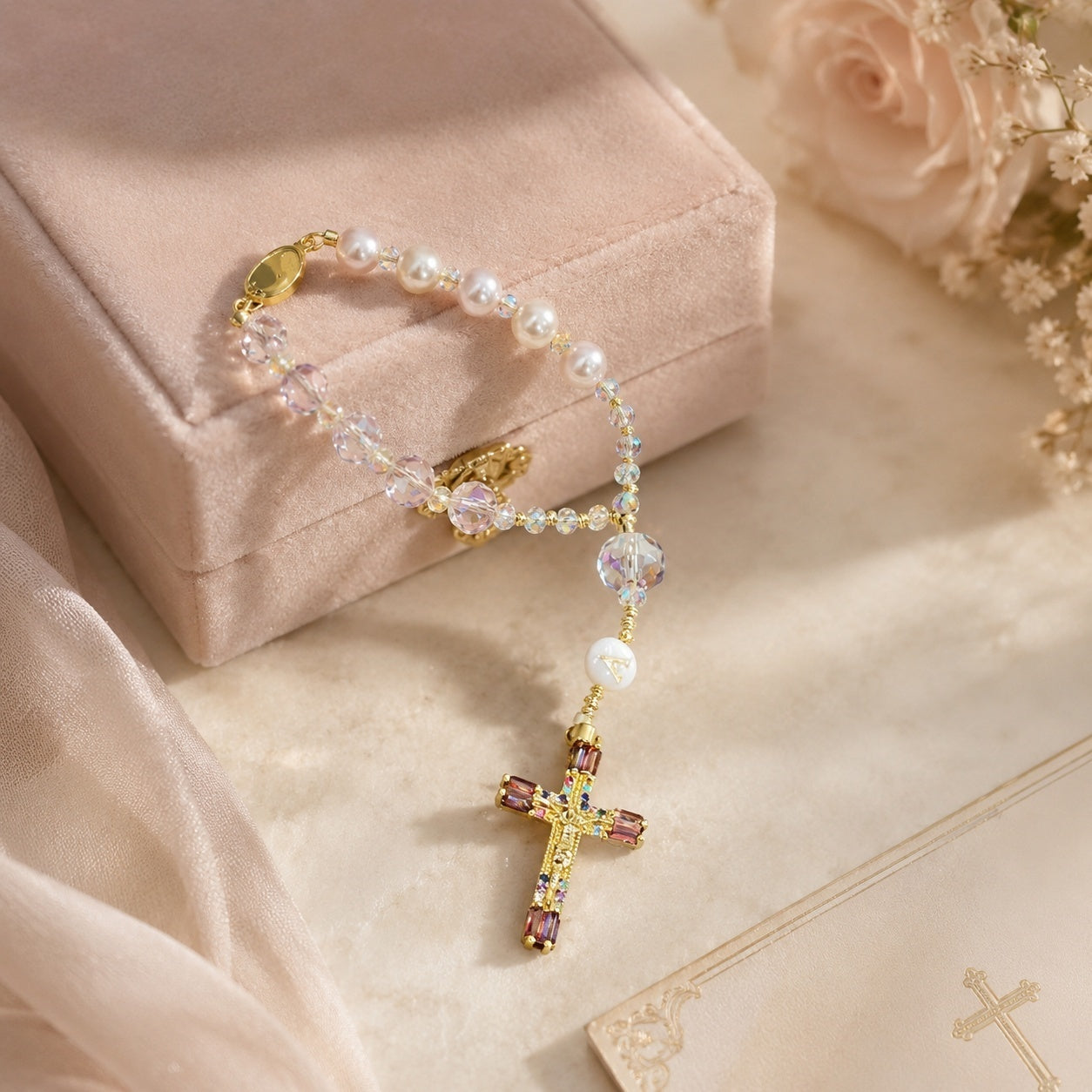 Pink Catholic car charm rosary with luminous crystal beads, initial letter bead, and gold crucifix for a meaningful driver gift