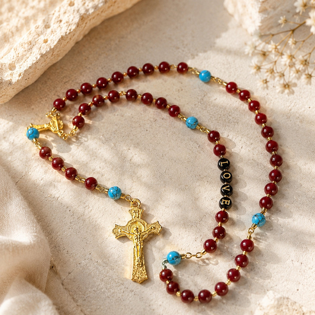 Handmade red rosary beads with gold-tone crucifix and blue turquoise-style accents, styled as a confirmation gift