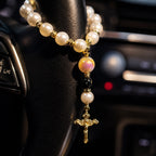 Catholic steering wheel rosary with pearl-style beads and gold crucifix, designed as a meaningful faith accessory for drivers