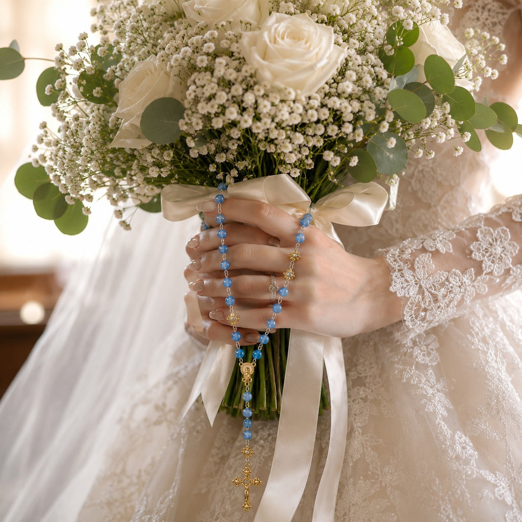Something Blue Catholic wedding rosary for bride with soft blue beads, gold crucifix, LOVE letter beads, and bridal bouquet styling